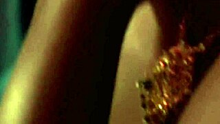 Sexy brunette flickering fire के पास नंगी होकर strip करती है