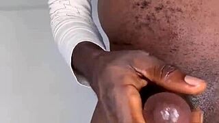 Watch this ninja man stroke his monster cock and cum?