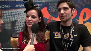 Fionna and Jimmy perform a Chaturbate video at the AE Expo with big tits
