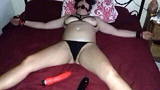blindfolded milf tied to bed awaits stranger’s touch.