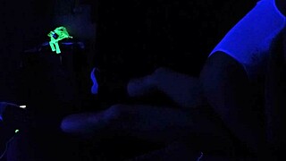 Carrie B Engages in Intense Blacklight Sex Scene, Sucking and Choking on Cock with Small Tits
