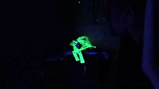 Carrie B Engages in Intense Blacklight Sex Scene, Sucking and Choking on Cock with Small Tits