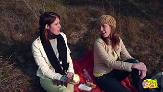 Picnic turns wild as brunette friends strap on for outdoor lesbian fun. Kissing leads to raw action.