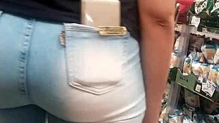 A Brunette Shows Off Her Hot Ass In The Market While Being Spied On.