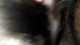 An interracial scene featuring moaning and deepthroat actions in a casual setting.