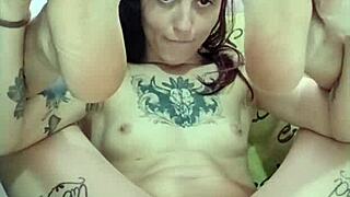 Young beautiful woman masturbating and coming with her toy