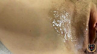 A young woman explores her body in a private moment.