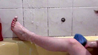 beautiful assol bathes with soapy foam covering her wet pussy and natural tits
