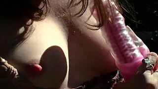 sweet babe fingers pussy with vibrator outdoors