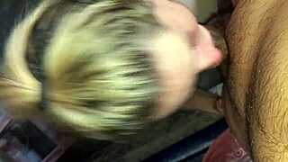 The blonde girlfriend with tattoos demonstrates her sloppy deepthroat technique, sucking and swallowing every drop.