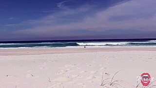 The naughty brunette gave me a blowjob on the beach in front of the bathers.