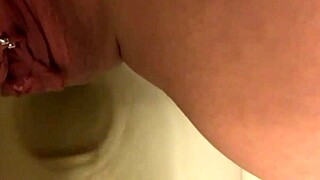 Pretty pierced pussy peeing solo in the bathroom toilet