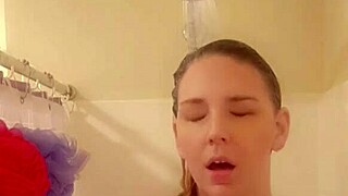 In the shower, she gets wet and starts touching herself sensually.