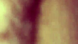 Bound and masked woman sucking cock in bondage.