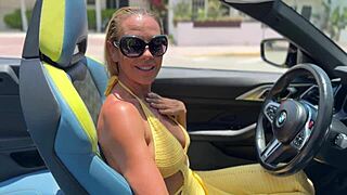 Blonde milf relaxing at the beach