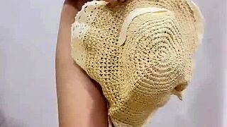 Beautiful asian teen unboxes items in bedroom close up.