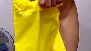 Beautiful asian teen unboxes items in bedroom close up.