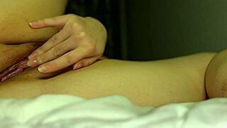 Tight pussy on the bed gets soaking wet from multiple orgasms!