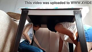 two brunette lesbians hide under the desk in jeans and miniskirts to masturbate passionately