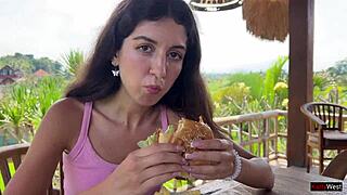 Skinny brunette flashes tight pussy in public cafe then gets facial from waiter.