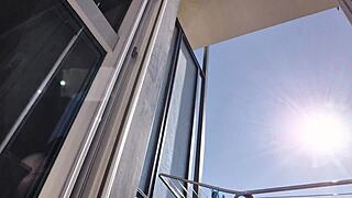 gorgeous latina shows off her pussy on the balcony without panties