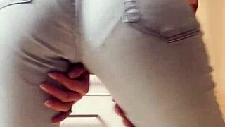 homemade video of petite blonde teen doing striptease dance in tight jeans in bedroom