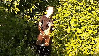 in a daring outdoor adventure, a brunette woman explores self-pleasure amidst nature, leading to an intense personal climax