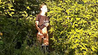 in a daring outdoor adventure, a brunette woman explores self-pleasure amidst nature, leading to an intense personal climax