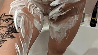 Milf gets naked in the shower, revealing big tits while bathing sensually in private moment.