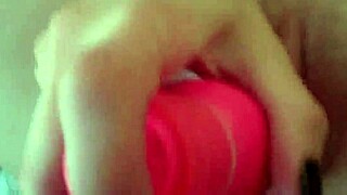 Petite brunette teen teases her pussy with massive pink dildo in solo play