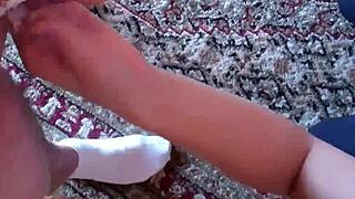 In a controlled session, the dominant figure manages the submissive's device for ultimate restraint and tease