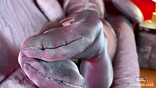 My long legs in anthracite nylon pantyhose tease with feet rubbing close up.