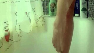 Why does this busty teen 18+ tease with perfect feet in steamy shower fetish play?