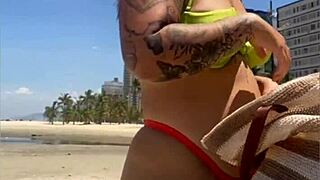 exhibitionist wife draws attention on the beach with her tiny bikini, flashing boldly