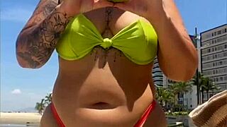 exhibitionist wife draws attention on the beach with her tiny bikini, flashing boldly