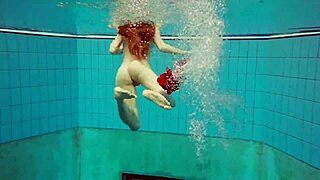 I dive underwater with hot Polish teen Marketa in bikini. we flash petite tits at public pool and beach