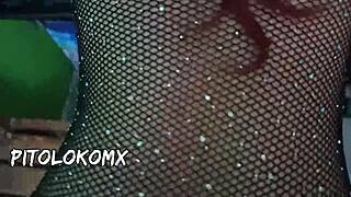 A young babe with big tits poses in dining room.