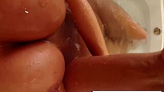 why not watch abigail in the shower, shaving her pussy smooth before masturbating those big tits?