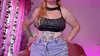 Hey, check out this curvy goth girl with big natural tits giving jerk off instructions using a huge dildo.