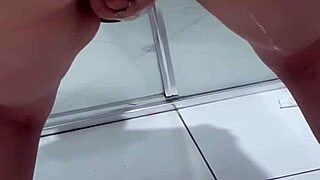 Hey, check out this juicy teen bent over peeing in the bathroom - so wild!