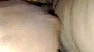 Boyfriend passionately fingers oiled hairy pussy of hot masturbating girl in intimate moment.