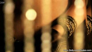 beautiful indian woman performs a seductive dance, teasing with striptease moves in softcore style.