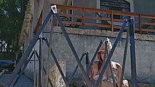 Setting up a tent on the farm while wearing a tight body outfit