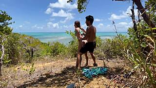 This sexy fit woman enjoys a beautiful day outdoors on the Brazilian beach with friends
