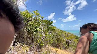 This sexy fit woman enjoys a beautiful day outdoors on the Brazilian beach with friends
