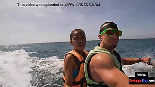 Oh man this Asian girlfriend is giving a blowjob in public on a jetski with her boyfriend.