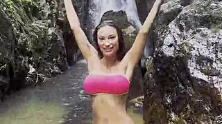 Monika Fox Walks Through Jungle In Pink Top Yellow Shorts Showing Big Tits Pierced Nipples Naked