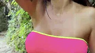 Monika Fox Walks Through Jungle In Pink Top Yellow Shorts Showing Big Tits Pierced Nipples Naked