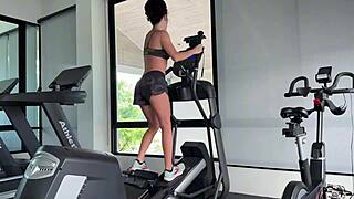 brunette fitness babe with muscular body and small tits poses in gym workout photoshoot.