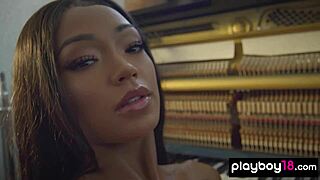 Check out this big boobed inked ebony beauty Harley Dean stripping to reveal her shaved pierced pussy